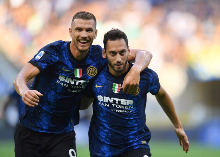 Inter Milan's Hakan Calhanoglu celebrates scoring their second goal with Edin Dzeko.
