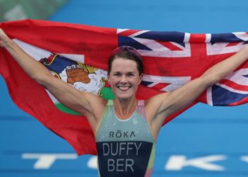 Flora, Kristian claim world triathlon titles