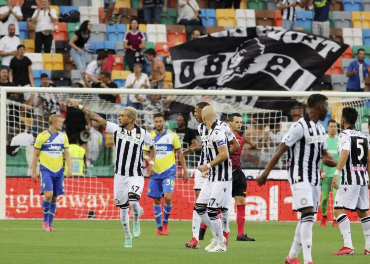 Udinese's Roberto Pereiyra (L) celebrates after scoring during the Serie A against Juventus in Udine, Italy.
