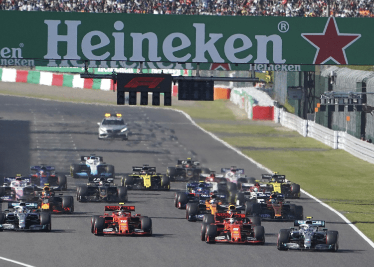 Photo showing Mercedes driver Valtteri Bottas, right, of Finland passes Ferrari driver Sebastian Vettel of Germany at the start of the Japanese Formula One Grand Prix at Suzuka Circuit in Suzuka on Oct. 13 2019.