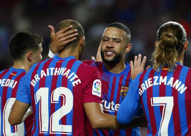 Barcelona players celebrate after Martin Braithwaite scored their side's second goal during La Liga against Real Sociedad at Camp Nou stadium in Barcelona.