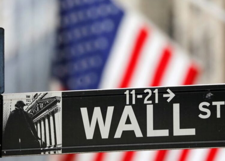 FILE PHOTO: A street sign for Wall Street is seen outside the New York Stock Exchange (NYSE) in New York City, New York, US, July 19, 2021.