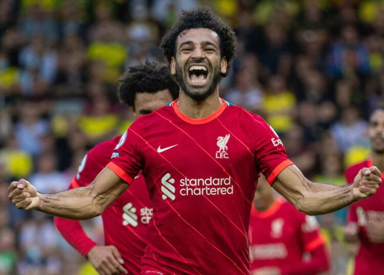 Liverpool's Mohamed Salah celebrates after scoring his side's third goal during against Norwich City in Norwich.
