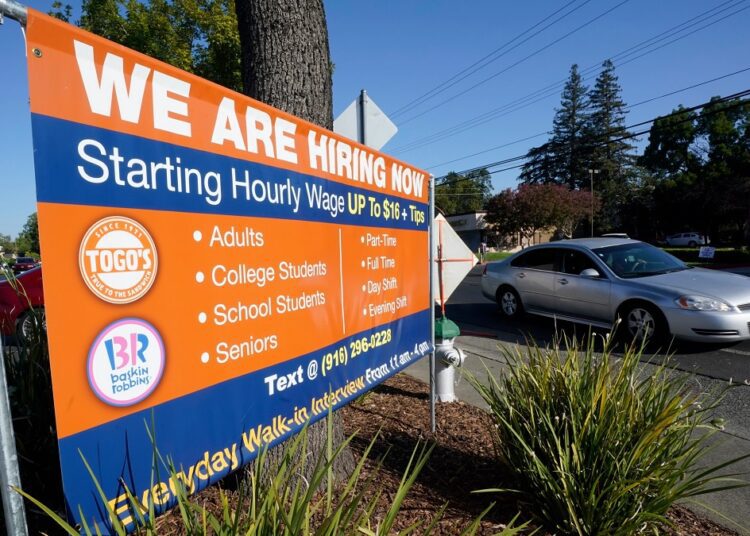US job openings hit a record 10.1 mln in June 1 - Egyptian Gazette A car passes a hiring banner in Sacramento, Calif., on July 16, 2021. Hiring in California slowed down in June 2021 as employers in the nation's most populous state tried to coax reluctant workers back into their pre pandemic jobs before the nation's expanded unemployment benefits expire in September.