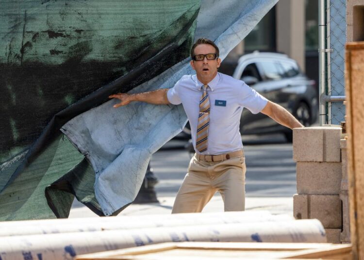 This image released by 20th Century Studios shows Ryan Reynolds in a scene from "Free Guy."