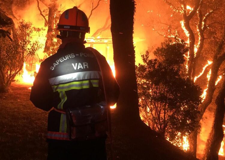 A fireman battling with a fire near Toulon early Tuesday, Aug. 17, 2021.