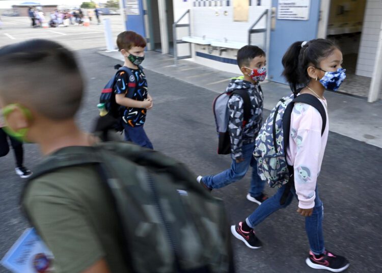 Students walk to class at Normont Elementary in Harbor City on August 16, 2021, on the first day of school for Los Angeles Unified School District.