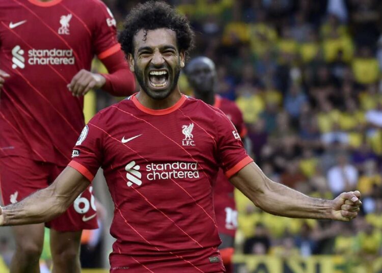 Liverpool's Mohamed Salah celebrates after scoring his side's third goal during the English Premier League match against Norwich City in Norwich, on Aug. 14, 2021.