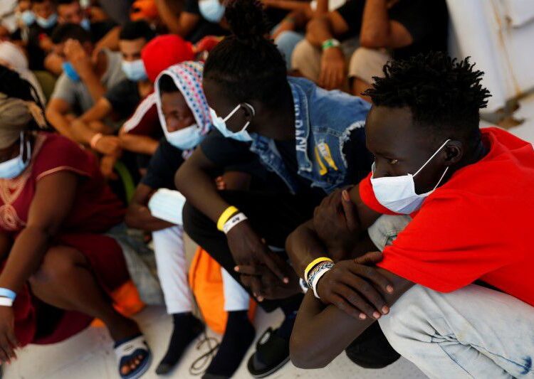 Rescue ship carrying 257 migrants docks in Sicily port 1 - Egyptian Gazette Migrants wait to be medically examined on board the German NGO migrant rescue ship Sea-Watch 3 after it arrived with 257 rescued migrants on board in Trapani on the island of Sicily, Italy August 7, 2021.