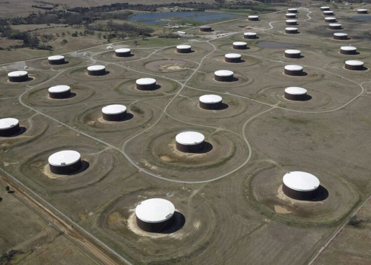 Crude oil storage tanks are seen from above at the Cushing oil hub, in Cushing, Oklahoma, US, March 24, 2016.