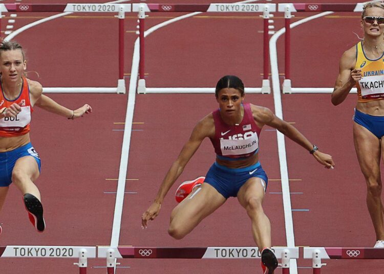 American Sydney McLaughlin (C) shattered her own 400 metres hurdles world record to win gold in 51.46 seconds.