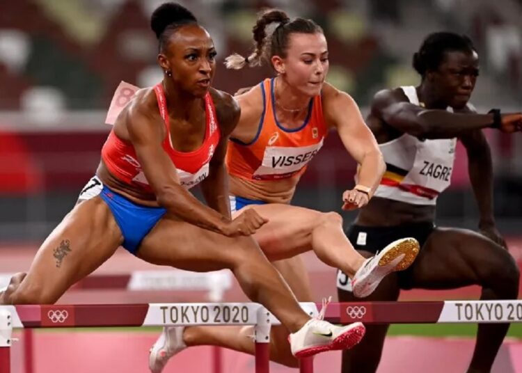Olympics-Athletics: Jasmine wins 100m hurdles semi 1 - Egyptian Gazette Puerto Rico's Jasmine Camacho-Quinn (L), Netherlands' Nadine Visser (C) and Belgium's Anne Zagre (R) compete in the women's 100m hurdles semi-finals during the Tokyo Olympic Games.