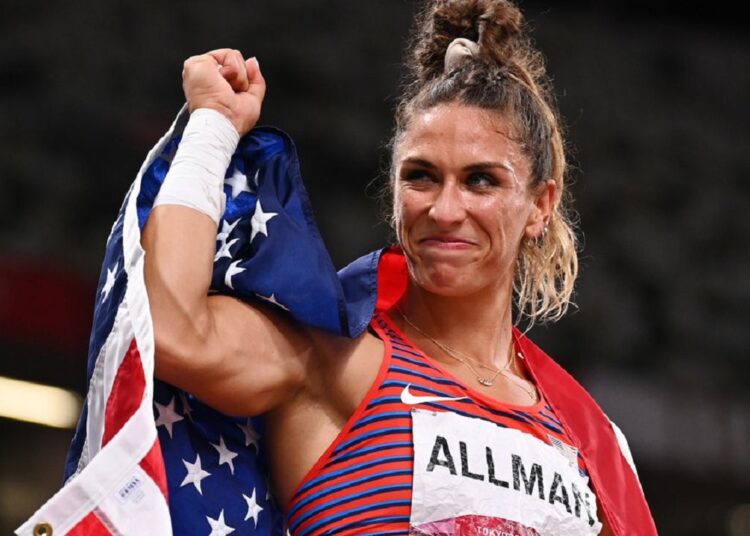 Olympics-Athletics: US Allman wins gold in discus throw 1 - Egyptian Gazette Valarie Allman of the United States celebrates with her national flag after winning gold.