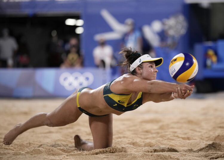 Mariafe Artacho del Solar, of Australia, stretches for the ball during a women's beach volleyball quarter-final match against Canada.