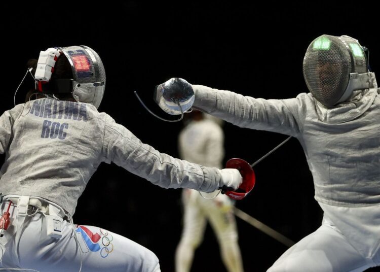 Olga Nikitina of the Russian Olympic Committee (L) in action against Norika Tamura of Japan at the Tokyo Olympics in Tokyo.