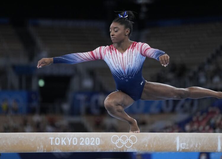 Simone Biles competes in the women's balance beam final at the Tokyo 2020 Olympic Games on Tuesday Aug. 3, 2021.