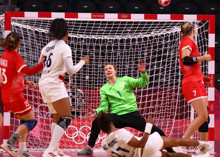 Anna Sedoykina of Russia saves a shot taken by Estelle Nze Minko of France at the Tokyo Olympics in Tokyo.