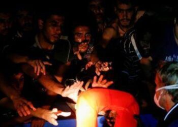 Rescuers pull 394 migrants from overcrowded boat off Tunisia