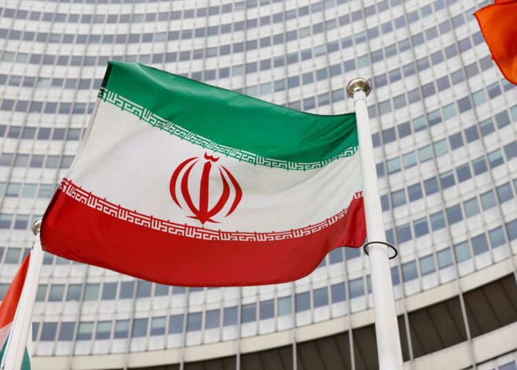 The Iranian flag waves in front of the International Atomic Energy Agency (IAEA) headquarters, amid the coronavirus disease (COVID-19) pandemic, in Vienna, Austria May 23, 2021.