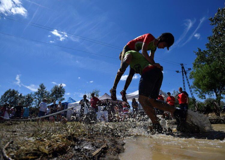 A participant competes in a wife-carrying championship in Tapiobicske, Hungary, August 7, 2021.