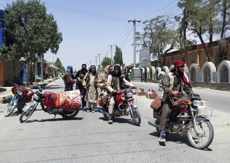 (Update) UN urges Afghanistan's neighbours to keep borders open as crisis looms 1 - Egyptian Gazette Taliban insurgents patrol inside the city of Ghazni, southwest of Kabul, Afghanistan on Aug. 12, 2021.