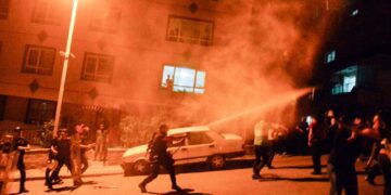 Turkey holds dozens more after attacks on Syrian shops