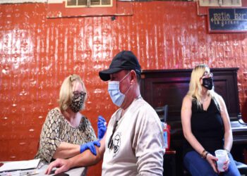 As Delta spreads, some travelers double up on COVID-19 vaccine in US