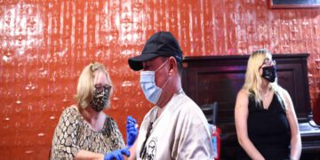 As Delta spreads, some travelers double up on COVID-19 vaccine in US