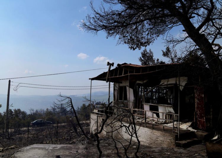 A burnt house during a wildfire in Thea area some 60 kilometers (37 miles) northwest of Athens, Greece.