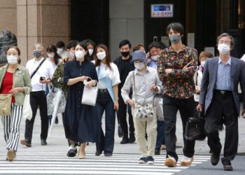 Japan extends, expands coronavirus emergency as cases surge