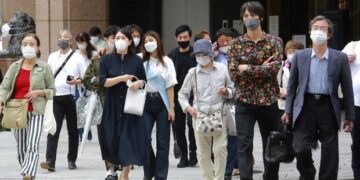 Japan extends, expands coronavirus emergency as cases surge
