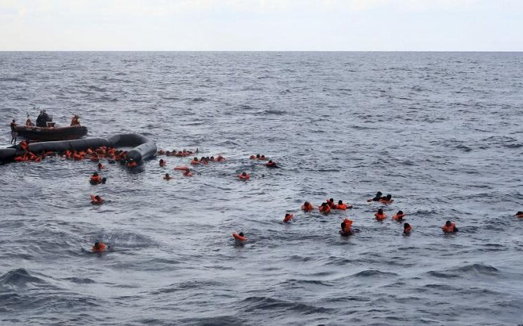 Refugees and migrants are rescued by members of the Spanish NGO Proactiva Open Arms, in the Mediterranean Sea, Nov. 11, 2020.