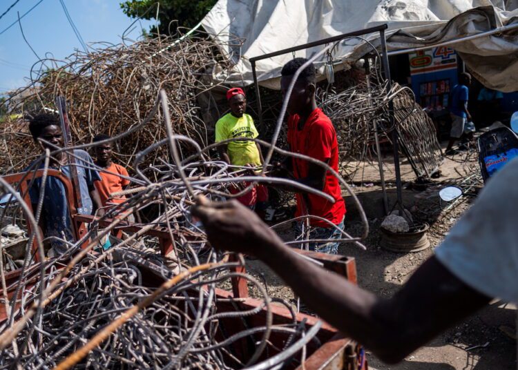 Haiti earthquake confirmed death toll rises above 2,200 1 - Egyptian Gazette People taking metal scavenged from houses destroyed by last week's 7.2 magnitude quake to a recycler in Les Cayes, Haiti August 21, 2021.