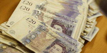 Sterling hovers near recent lows, unmoved by inflation slowdown