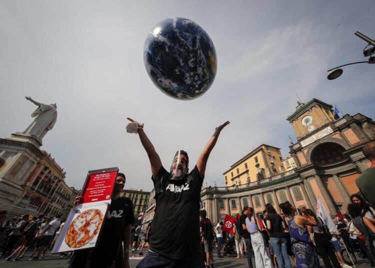 A file photo of people demonstrating on the sidelines of a G20 environment meeting, in Naples, Italy.