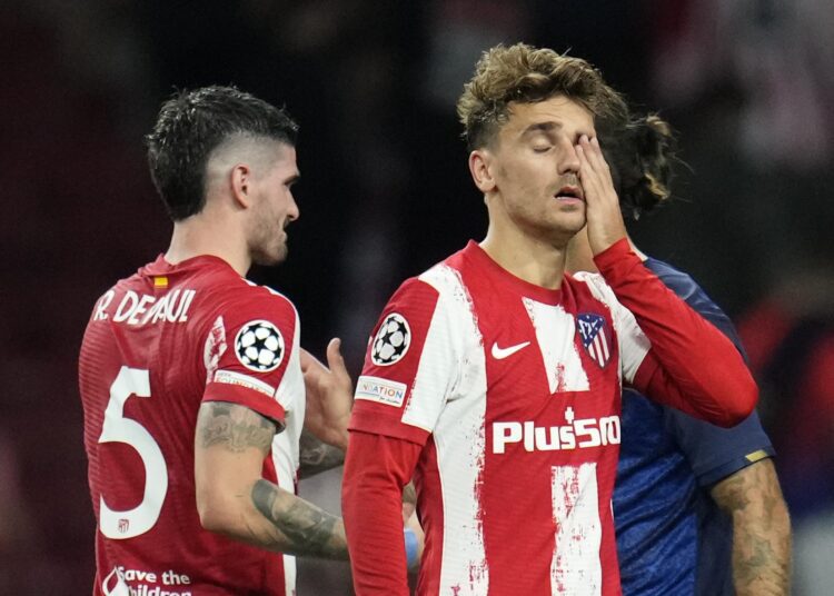 Atletico Madrid's Antoine Griezmann wipes his eyes at the end of the Champions League Group B match against Porto in Madrid, Spain, Wednesday, Sept. 15, 2021.