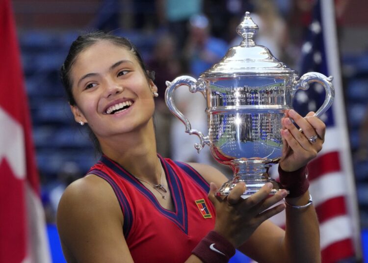Britain’s Emma Raducanu celebrates with the trophy after winning the 2021 US Open women’s final match in New York.