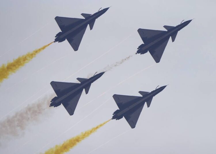 Members of the "August 1st" Aerobatic Team of the Chinese People's Liberation Army (PLA) Air Force perform during the 13th China International Aviation and Aerospace Exhibition, also known as Airshow China 2021, on Tuesday, Sept. 28, 2021, in Zhuhai in southern China's Guangdong province