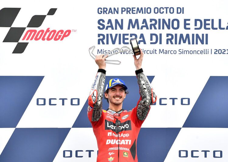 Ducati Lenovo Team's Francesco Bagnaia celebrates with the trophy on the podium after winning the San Marino Grand Prix, in Misano, Italy.