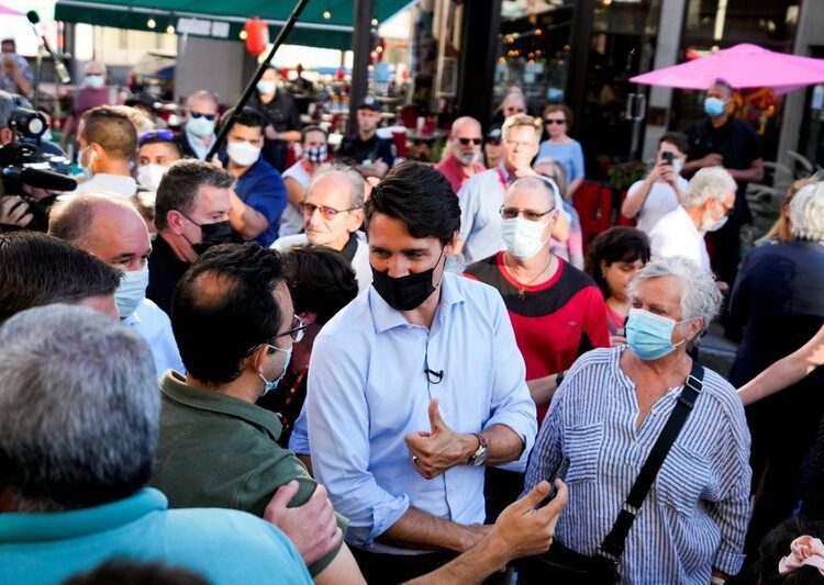 All eyes on turnout as Canada's tight election campaign enters final days 1 - Egyptian Gazette Canada's Liberal Prime Minister Justin Trudeau during gestures an election campaign stop in Trois-Rivieres, Quebec, Canada.
