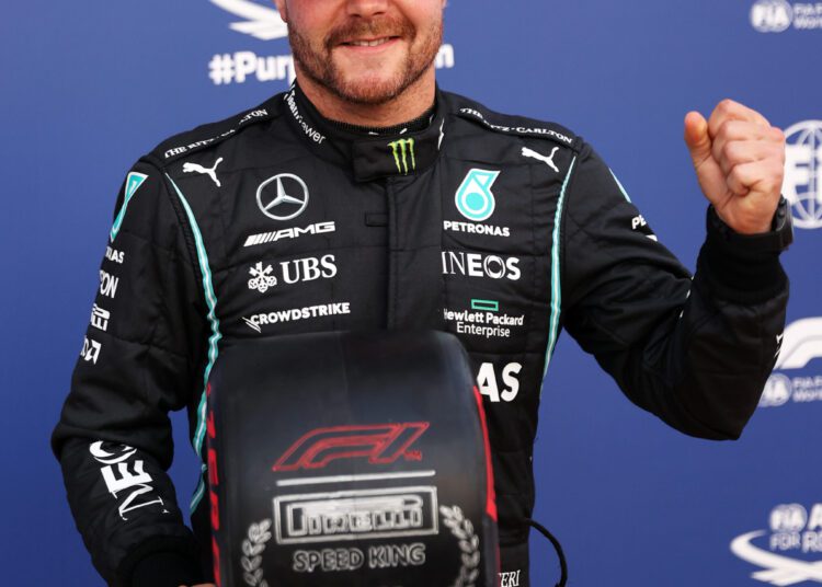 Mercedes driver Valtteri Bottas of Finland reacts after after he clocked the fastest time during the qualifying session at the Monza racetrack, in Monza, Italy. The Formula one race will be held on Sunday.