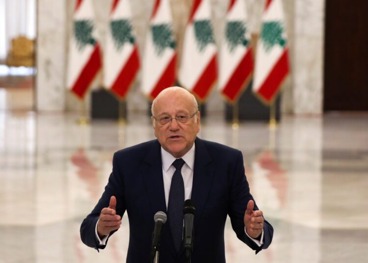 Lebanon agrees new government to tackle economic collapse 1 - Egyptian Gazette A file photo of Lebanon's Prime Minister Najib Mikati, gesturing as he talks at the presidential palace in Baabda, Lebanon July 26, 2021.