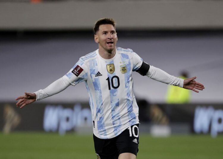 Argentina's Lionel Messi celebrates scoring their first goal against Bolivia at El Monumental, Buenos Aires.