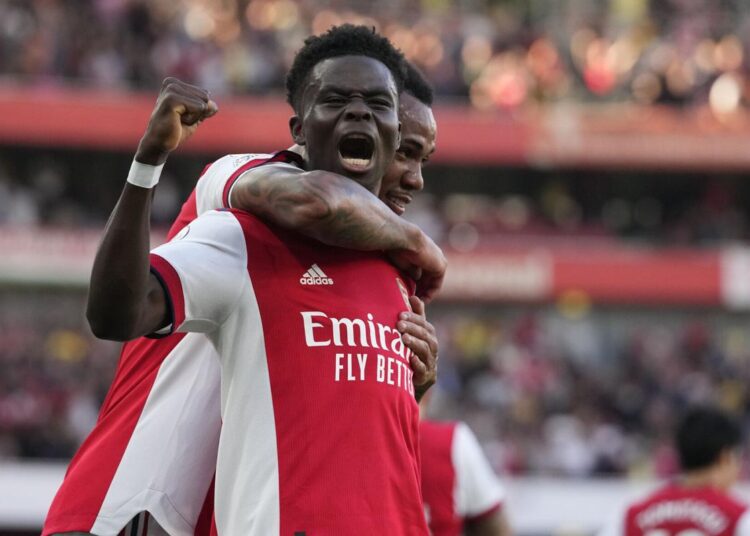 Arsenal's Bukayo Saka celebrates after scoring his side's third goal during the English Premier League match against Tottenham Hotspur.