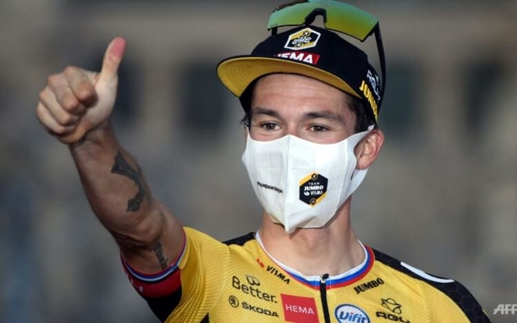 Primoz Roglic celebrates after winning the Vuelta Cycling race in Santiago, Spain.