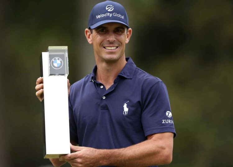 Billy Horschel of the US lifts the trophy after victory during the PGA Championship at Wentworth Golf Club.