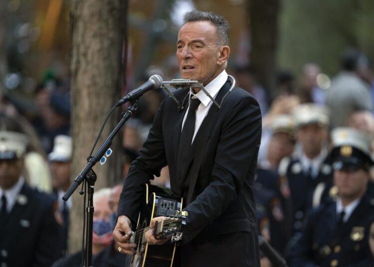 FILE - In this Saturday, Sept. 11, 2021, file photo, Bruce Springsteen performs during ceremonies to commemorate the 20th anniversary of the 9/11 terrorist attacks, at the National September 11 Memorial & Museum in New York. Springsteen’s most memorable artifacts including his favorite Fender guitar and stage outfits will be on display in a traveling interactive exhibit. The Grammy Museum announced Tuesday, Sept. 14, 2021, that Bruce Springsteen Live! will open at the Grammy Museum Experience in the Prudential Centre in Newark, New Jersey, on Oct. 1.
