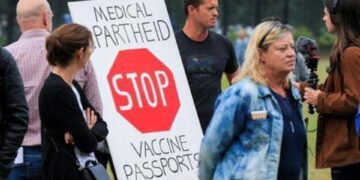 Dutch marchers protest new Covid-19 pass to enter bars, restaurants