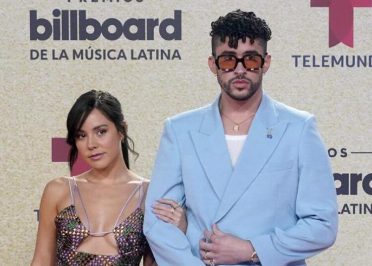 Bad Bunny (R) and Gabriela Berlingeri arrive at the Billboard Latin Music Awards on on Sept. 23, 2021, at the Watsco Center in Coral Gables, Florida.