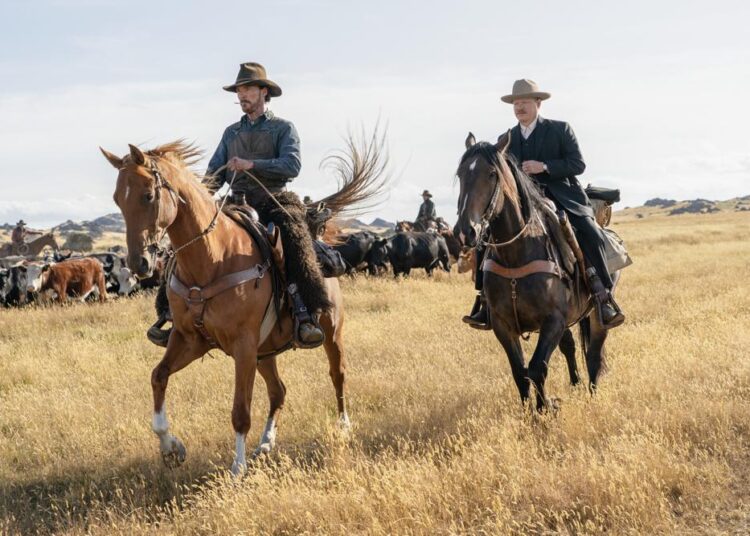 This image released by Netflix shows Benedict Cumberbatch, left, and Jesse Plemons in a scene from "The Power of the Dog."